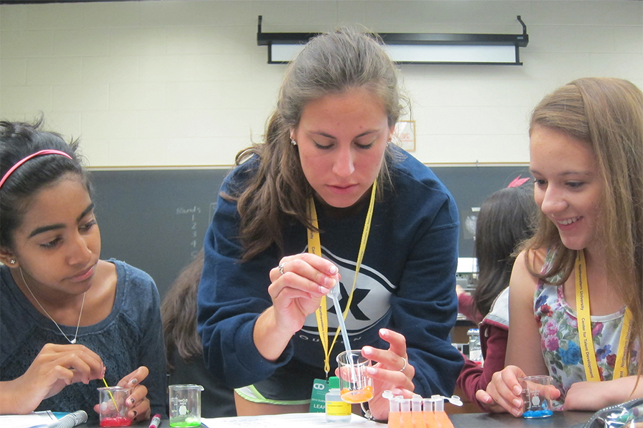 Three girl students working together 