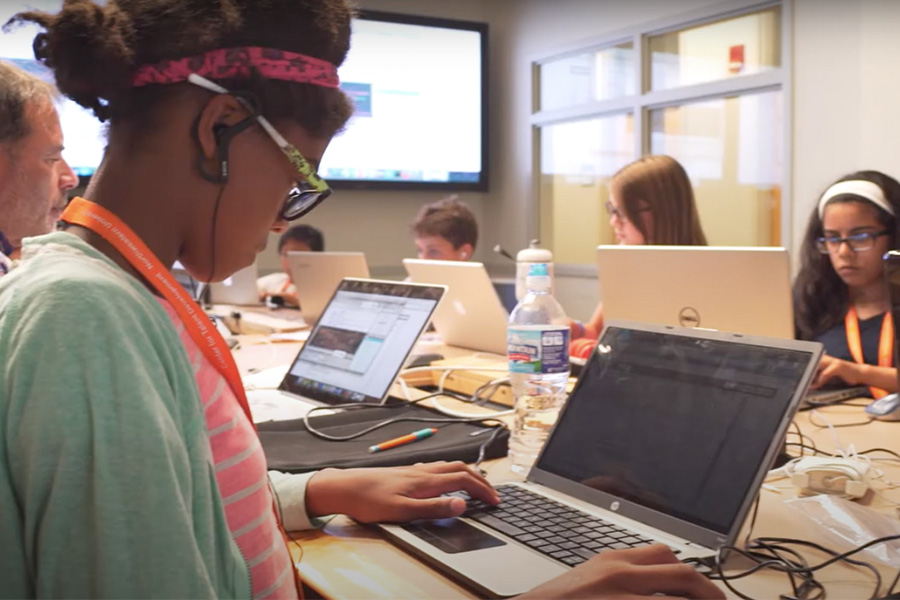 girl on laptop in classroom