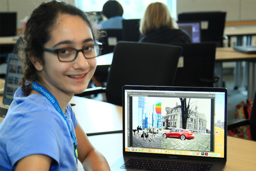 girl working on coding on her laptop