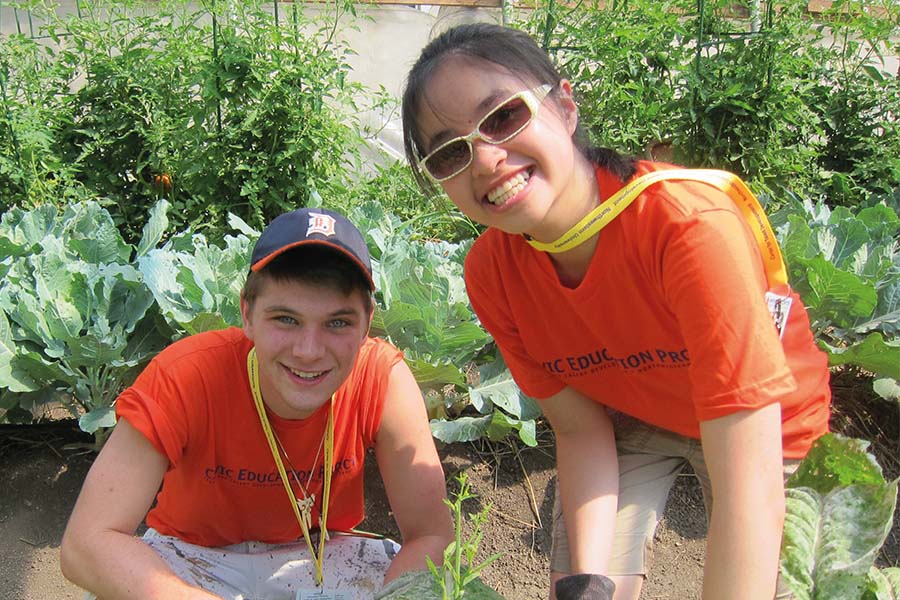 boy and girl in CEP t-shirts in garden