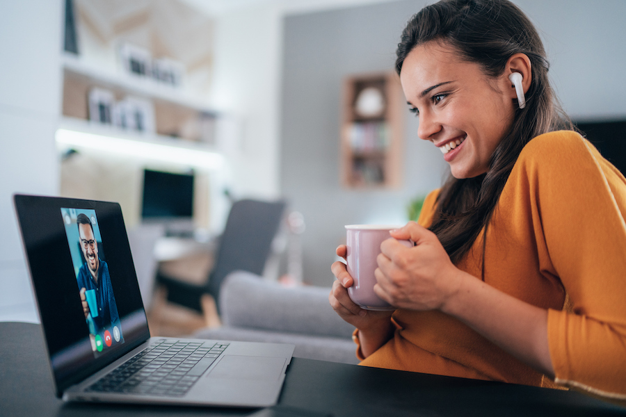 parent on computer listening to webinar