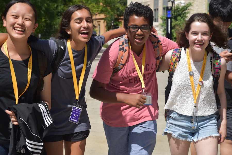 middle school students walking on campus