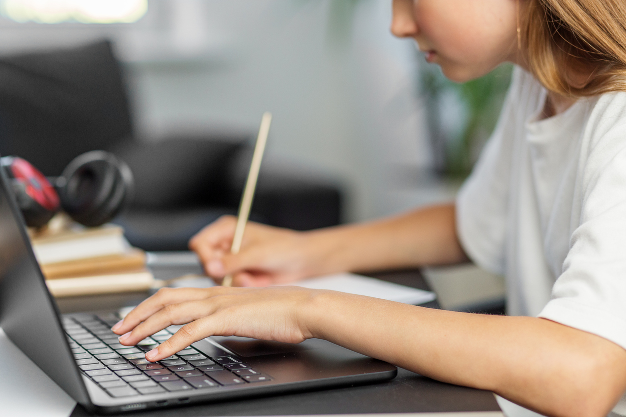 student taking a test on a laptop