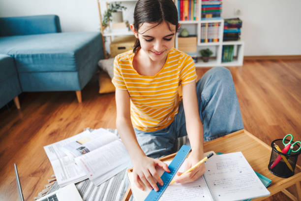 middle school girl working at home on math