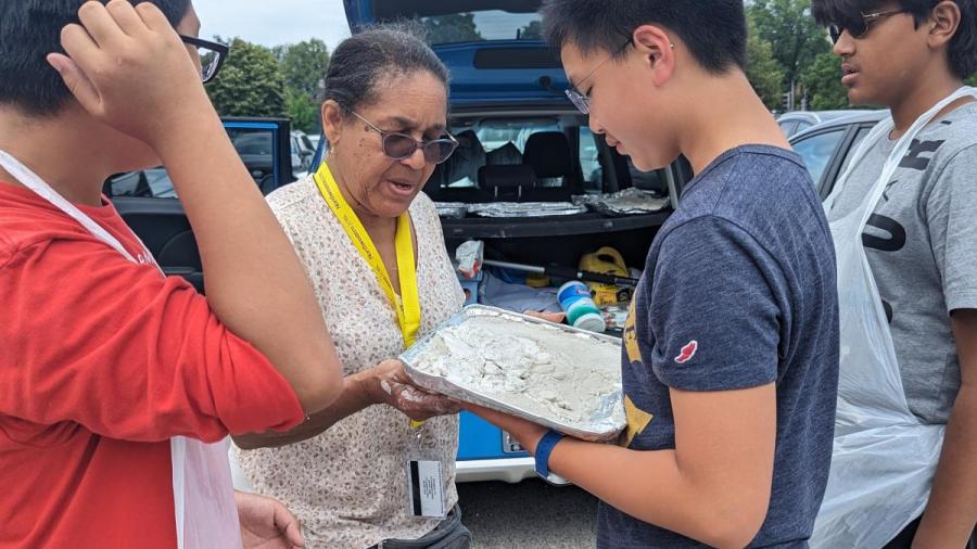 STEM teacher Elizabeth Copper showing students a forensic experiment