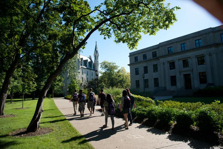 Young students walking on school campus 