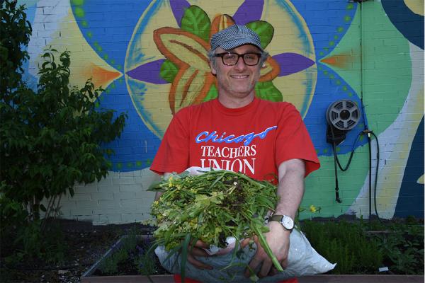 CEP staff member serving at an urban garden.