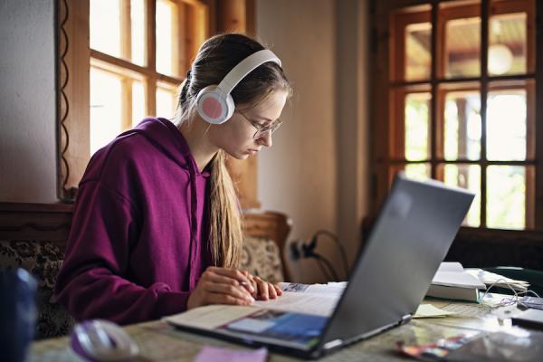 high school girl working online at home