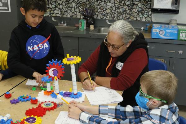 Teacher explaining project to students 