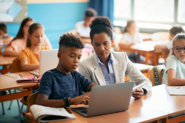 Student and Teacher with laptop